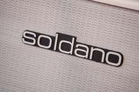 Soldano logo badge detail on the white 1x12 cabinet grille