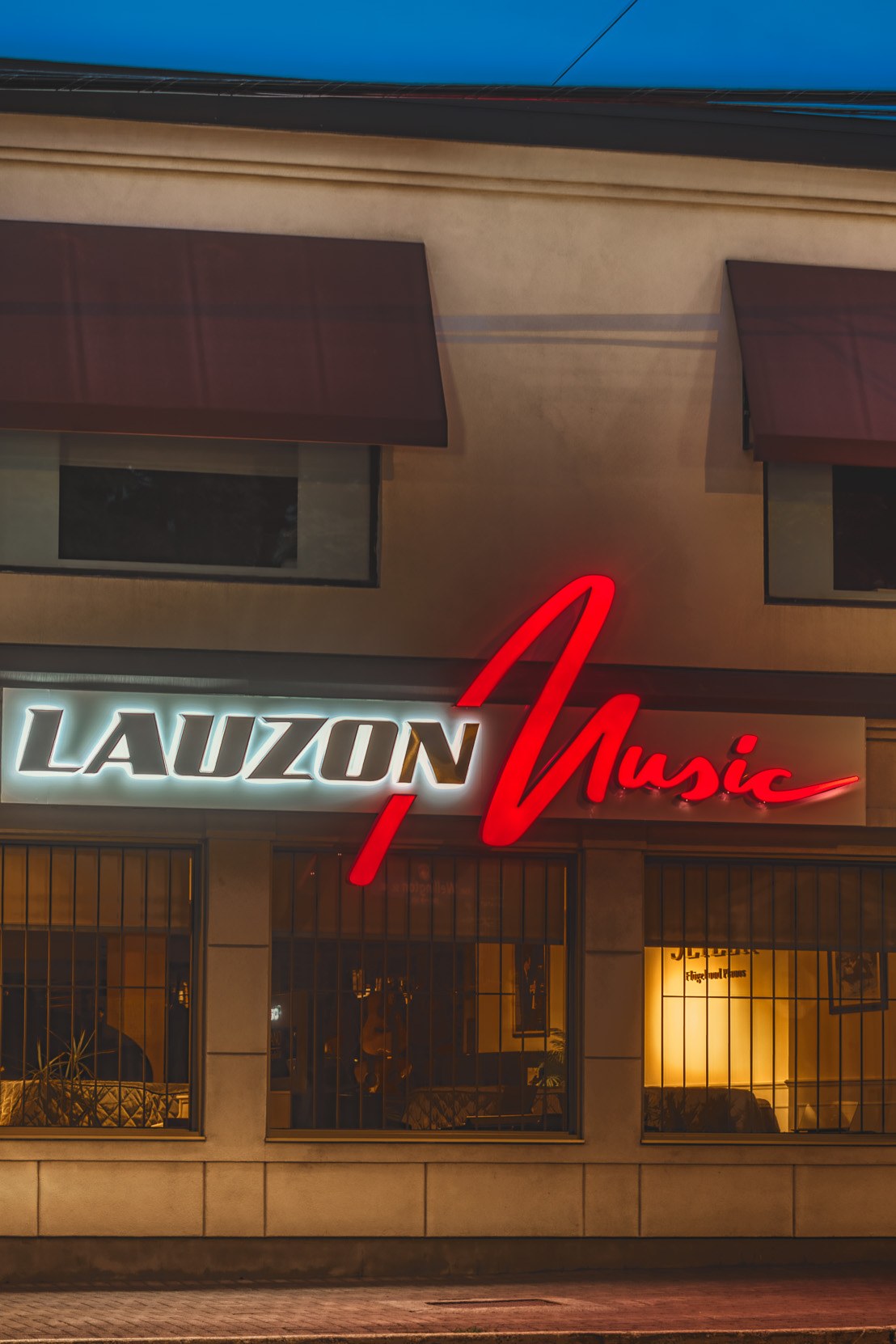 Lauzon Music storefront at dusk